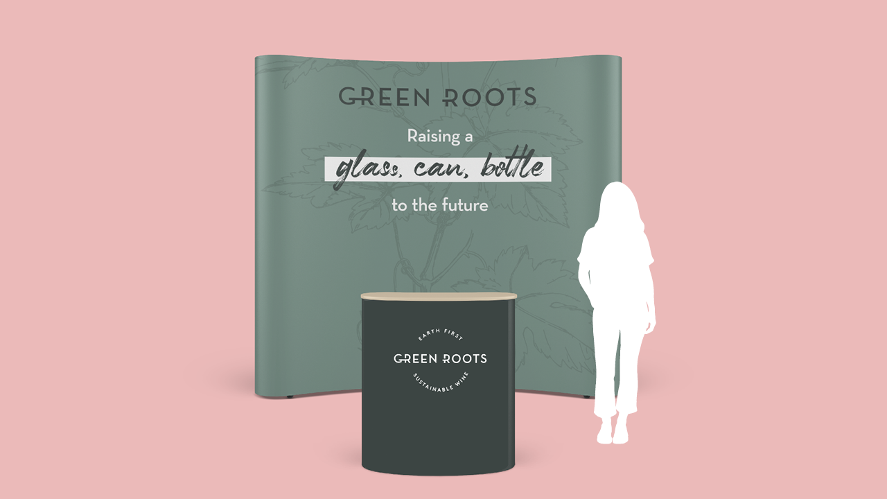 Green Roots exhibition stand in muted green with the line raising a glass, can, bottle to the future.